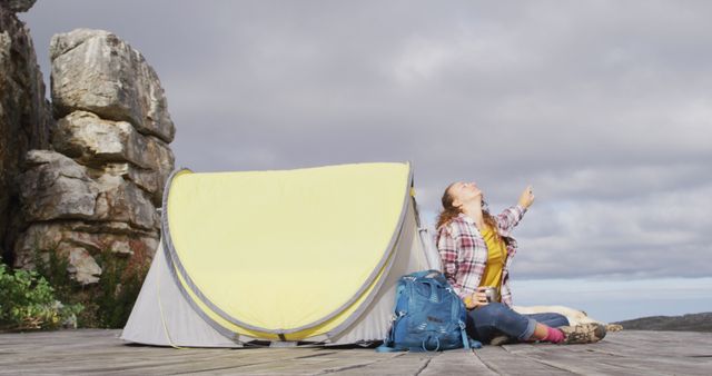 Happy Camper Relaxing by Yellow Tent on Deck Overlook - Download Free Stock Images Pikwizard.com