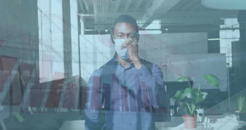 Businessman Analyzing Data with Mask in Office Setting