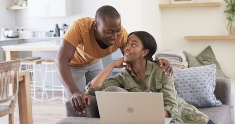 Couple Using Laptop Together in Cozy Living Space - Download Free Stock Images Pikwizard.com