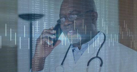 Senior physician consulting by phone with telemedicine data overlay and stethoscope