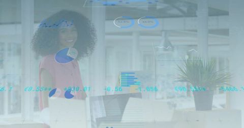 Smiling woman analyzing digital analytics in modern office