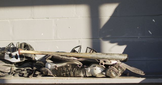 Close-up of Baseball Equipment in Dugout Shadow - Download Free Stock Images Pikwizard.com