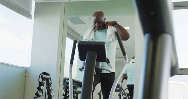 Image of senior african american men is exercising at the gym. Retirement lifestyle, active leisure time.