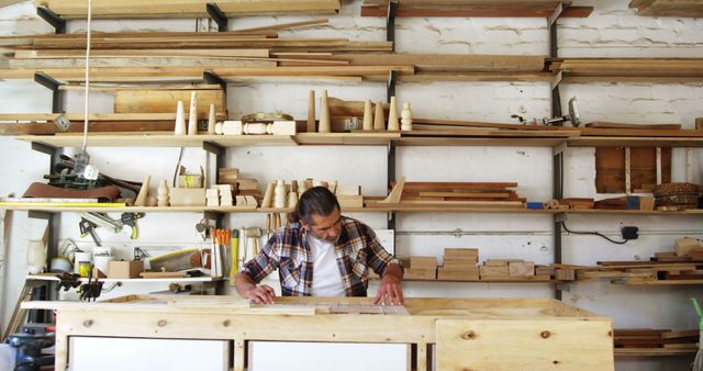 Carpenter Working in Workshop with Precision Tools and Wooden Shelves - Download Free Stock Images Pikwizard.com