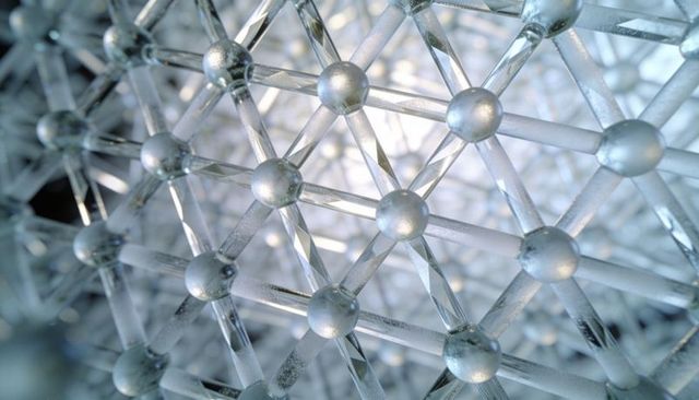 Glowing crystal lattice featuring metallic nodes and frosted translucent struts