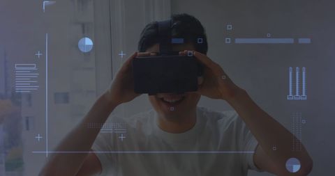 Asian Man Enjoying Virtual Reality at Home with HUD Elements