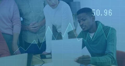 Team analyzing financial data in modern office with digital chart overlay