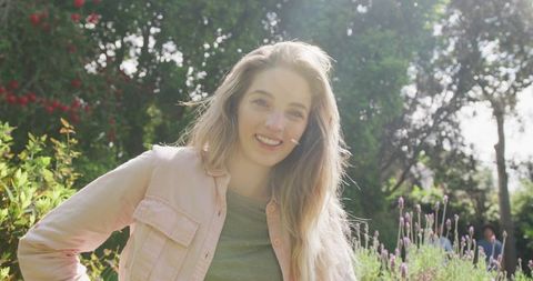 Happy Woman Enjoying Sunny Day in Lush Garden - Download Free Stock Images Pikwizard.com