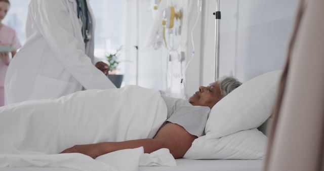 Doctor Treating Elderly Woman Patient in Hospital Bed - Download Free Stock Images Pikwizard.com