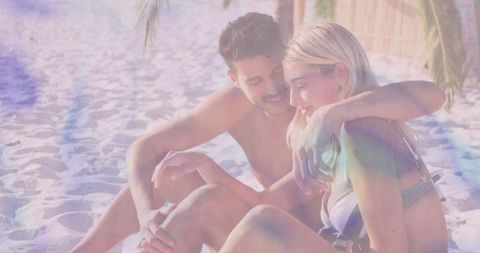 Romantic couple sharing intimate moment on tropical beach