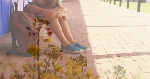 Lonely Schoolboy Sitting Outdoors with Grass Overlay - Download Free Stock Images Pikwizard.com