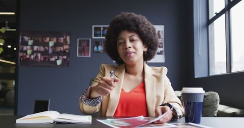 Confident Businesswoman Discusses Paperwork in Modern Office - Download Free Stock Images Pikwizard.com