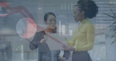 Diverse Business Leaders Analyzing Financial Data in Modern Office