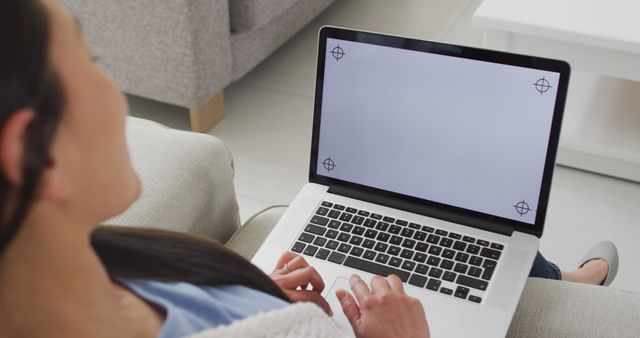 Person using laptop with blank screen on couch - Download Free Stock Images Pikwizard.com