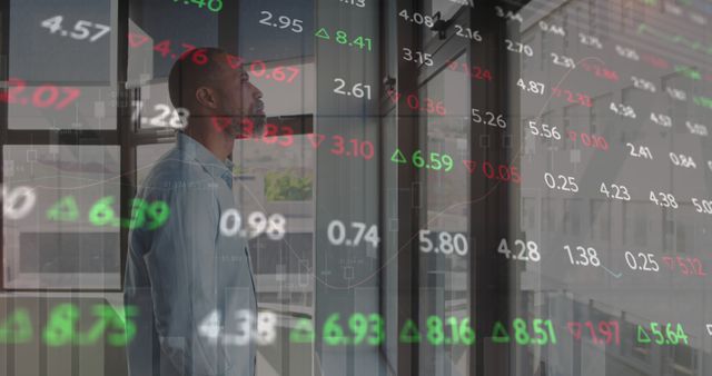 Businessman Analyzing Stock Market Data Reflective in Office Window - Download Free Stock Images Pikwizard.com