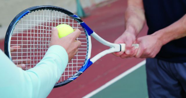 Tennis Coaching Session Holding Racket and Ball - Download Free Stock Images Pikwizard.com