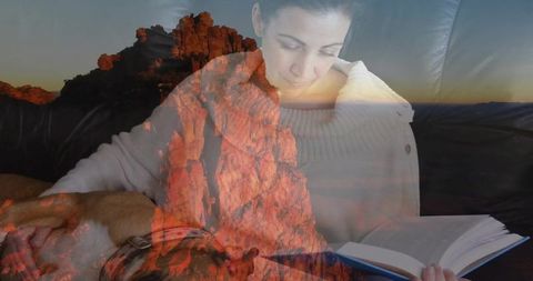 Woman reading book blends with majestic red rock landscape