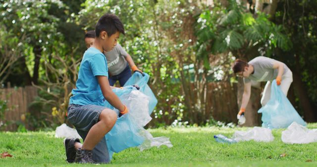 Children and Adults Picking Up Trash in Park - Download Free Stock Images Pikwizard.com