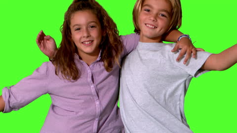 Brother and Sister Hugging on Green Screen Background