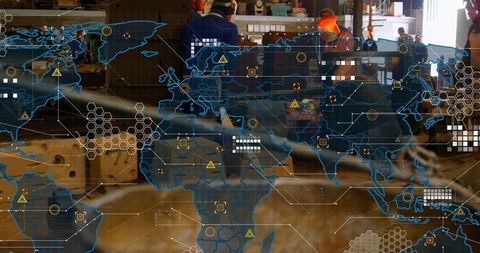 Industrial Technicians Analyzing Digital Interfaces in Modern Factory