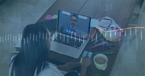 Telemedicine consultation woman taking notes at home office desk