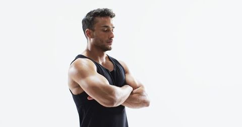 Athletic Man Performing Pre-Workout Stretching on White Background - Download Free Stock Images Pikwizard.com