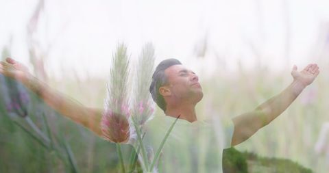 Man Embracing Nature with Open Arms in Blur Background