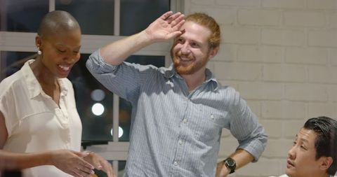 Friendly coworker consoling stressed colleague in office setting