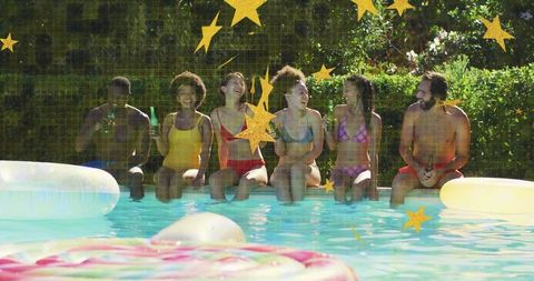 Friends Enjoying Lively Poolside Chat in Swimwear