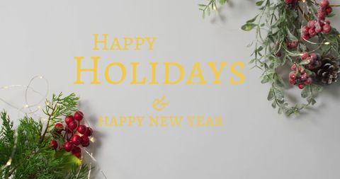 Festive Holiday Greetings with Christmas Decorations on Grey Background