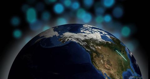 Earth rotating over north america revealing cyan light trail and bokeh space background