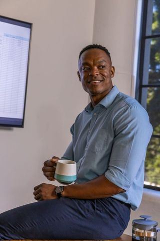 Business professional contemplating in modern office