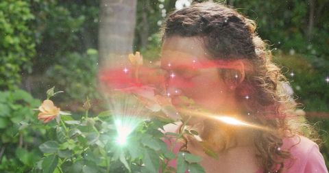 Woman experiencing nature enhanced with ethereal flares in garden