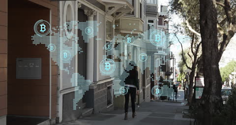 Cryptocurrency Bitcoin Symbols Over World Map on City Street