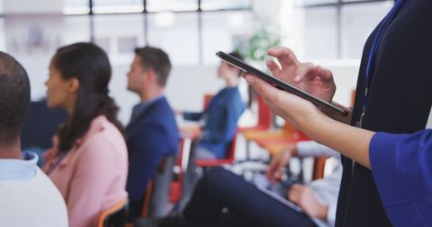 Businesswoman Using Tablet During Office Meeting