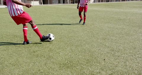 Soccer Players in Action on Artificial Turf Field