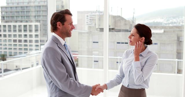 Business people shaking hands in modern office - Download Free Stock Images Pikwizard.com