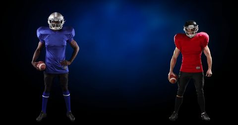Diverse american football players facing off on dark background