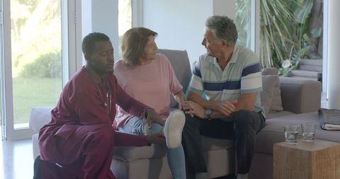Doctor Provides In-Home Examination for Senior Couple's Foot Health
