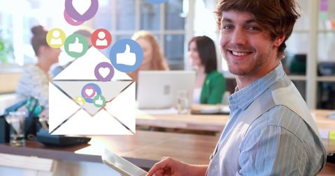 Young Professional Enjoying Digital Communication in Office