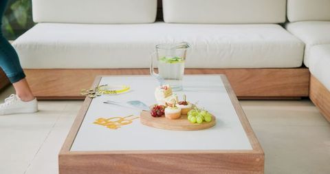 Lemonade Pitcher and Snacks on Coffee Table in Bright Room