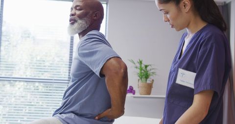 Senior Man Receiving Physical Therapy for Back Pain