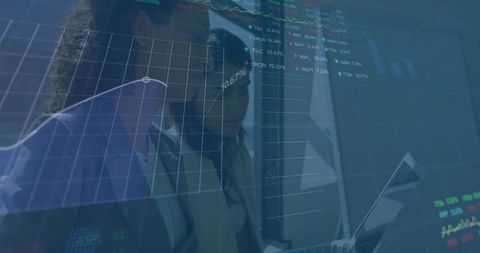 Colleagues analyzing financial data on digital interface overlay