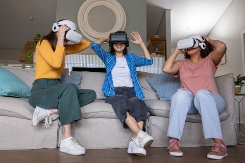Women experiencing immersive vr technology at home