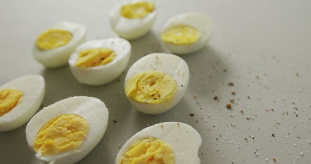 Halved Boiled Eggs Topped with Seasoning on a Clean Surface - Download Free Stock Images Pikwizard.com