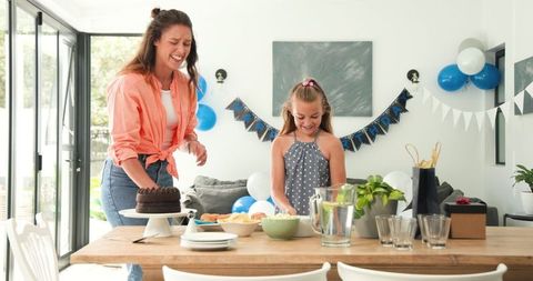 Mother and Daughter Preparing for Birthday Celebration at Home