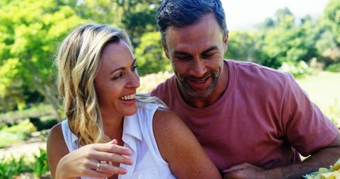 Middle-Aged Couple Enjoying Time Outdoors with Laughter - Download Free Stock Images Pikwizard.com