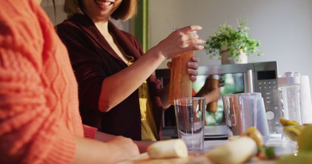 Women Preparing Fresh Fruit Smoothies in Kitchen - Download Free Stock Images Pikwizard.com