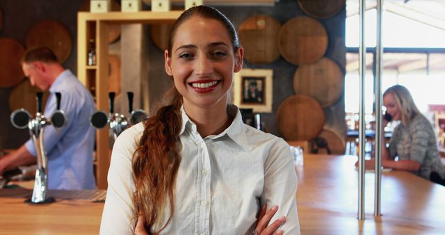 Smiling Bartender in Casual Bar with Wooden Barrels - Download Free Stock Images Pikwizard.com