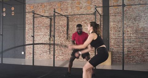 Gym Coaching Session with Battle Ropes for Strength Training